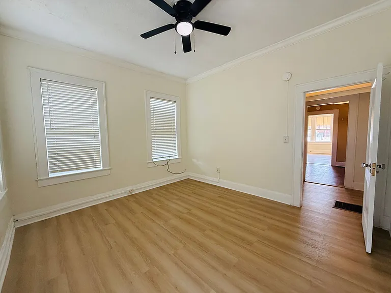 view of the bedroom with new luxury vinyl flooring-tall ceilings