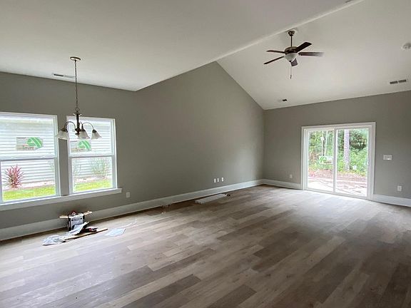 Open living room with laminate flooring.