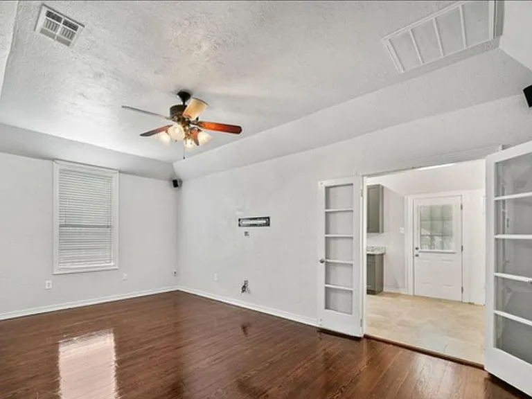 Central Living room with french doors to kitchen/back door