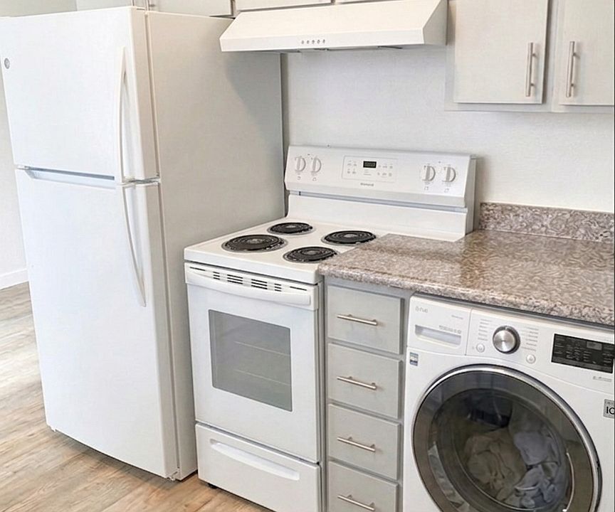 Kitchen with electric stove and dryer hook up
