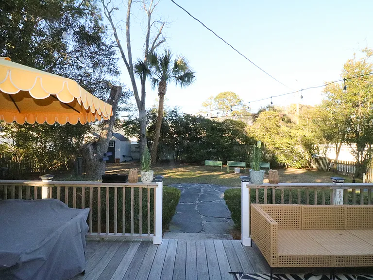 Step off the patio into the back yard. Corner lot offers direct entry from street parking into back yard