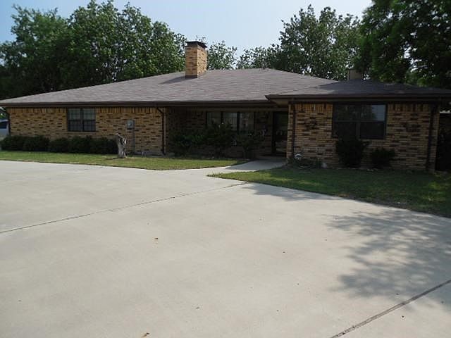 Front of home with circle drive.