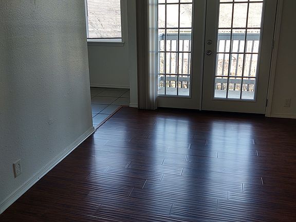 Living room view to French doors and balcony