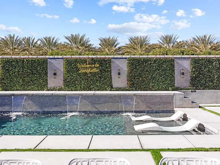 The waterfalls from the pool provide a serene sound.