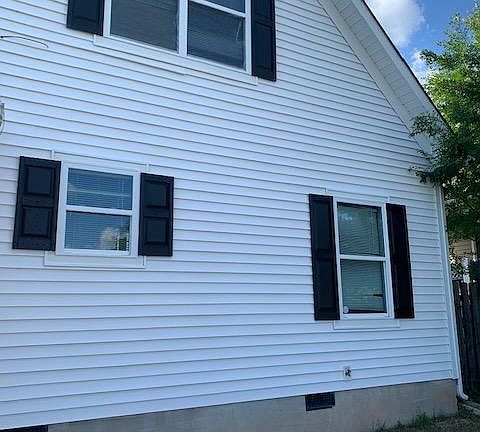 Rear of Home...Small Fenced in backyard, 2 spaces for off street parking in rear of the home. On street parking also available.