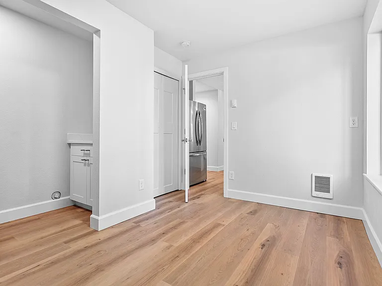 Home office. Open door to kitchen.