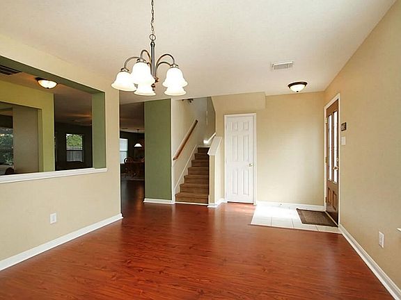 Dining Room: Upgraded light fixture and wood laminate flooring.