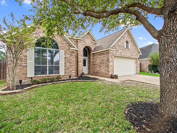 The flower beds are ready for Spring with new shrubs and fresh mulch