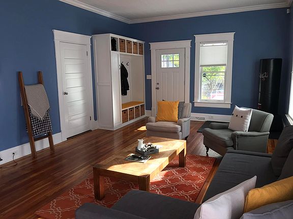Open plan living area with custom built entry storage - House includes custom trim, original features, new windows and custom made cellular and blackout blinds