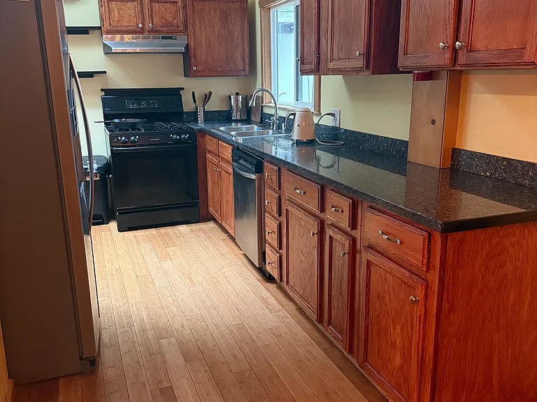 Sunny full kitchen with space for two or a family to cook!