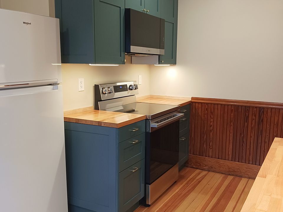 New kitchen freshly completed for move-in. Includes electric range, microwave, and dishwasher.
