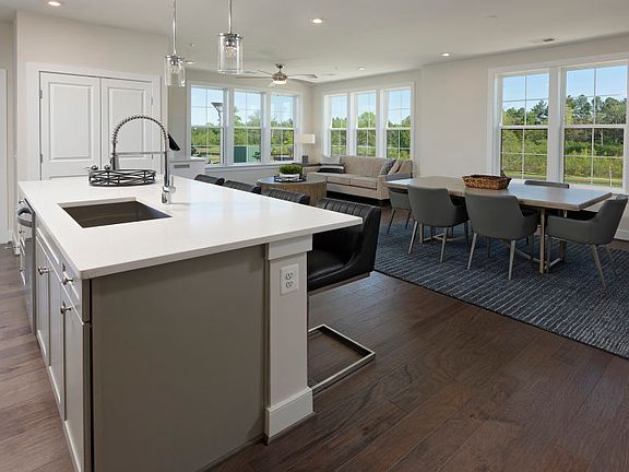 Model Representation - Open layout design in the Ava with a large kitchen island.