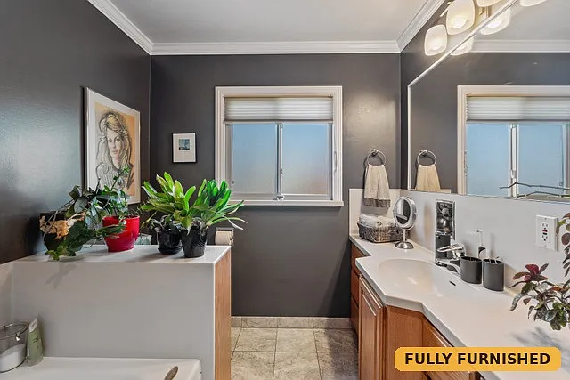 Full bathroom on the main level features a jacuzzi deep soak tub as well as a separate shower stall.