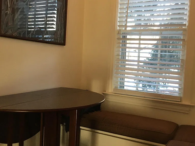 Option#1: Window seat area: Gate-leg table can be used like a console, as seen, or table leafs raised on both sides to be a full round table. This allows for plenty of working space and seating around the table, inside the window seat area.