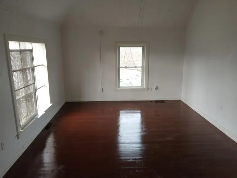Living room with refinished wood floors