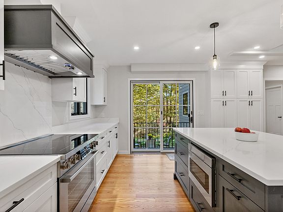 Stunning Kitchen with Range, Microwave drawer, hood and view of sliders out to back