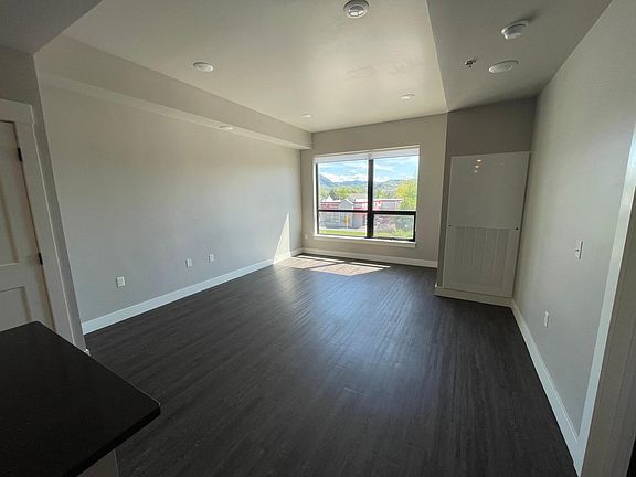 Large living room space with huge windows and lots of natural light