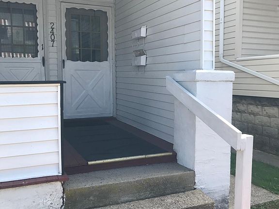 Shared Front porch Area. Entrance to available unit is on the right.