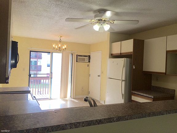 Dining area leads to private balcony.