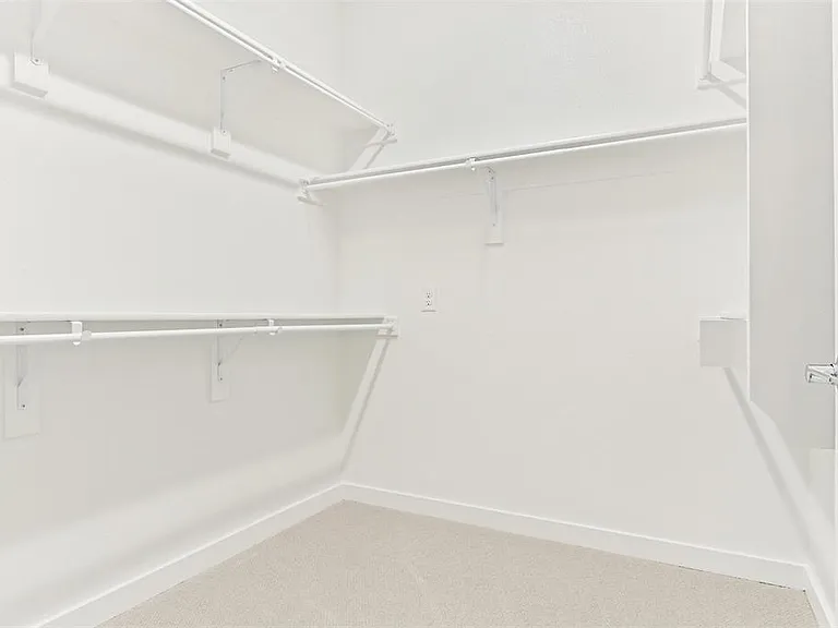 Large walk-in closet with ample storage space.