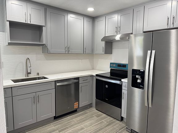 Brand new kitchen: new cabinets, handles, backsplash, appliances, flooring, lights, faucet, sink.