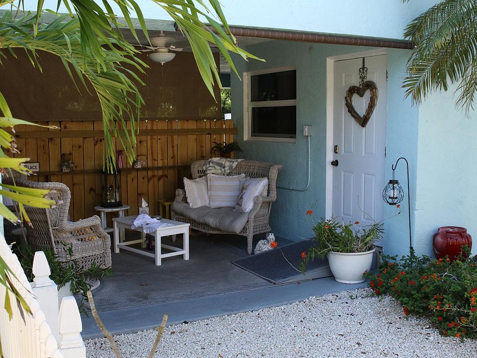 Front patio. Door in picture was upgraded to hurricane resistant glass door pictured in other photos.