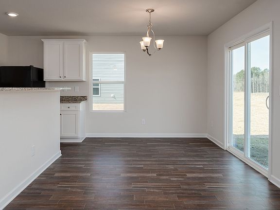 Dining area has gorgeous vinyl plank flooring