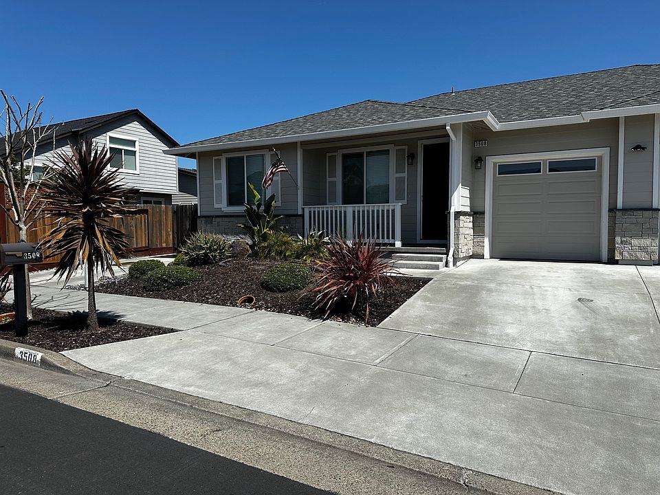 Front of duplux with 1 car garage.