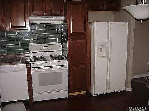 One side of the Kitchen, other side has space for dining tab