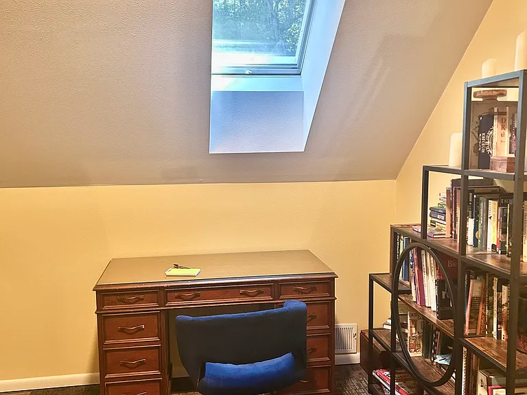 dedicated workspace: skylight opens for fresh air, high speed internet, reading materials, shelf space.