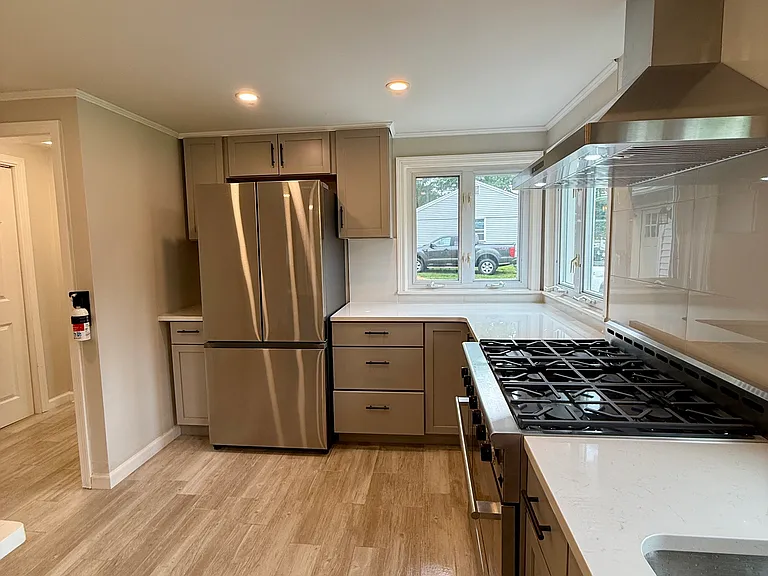 modern open concept kitchen with brand new appliances and Bosch dishwasher