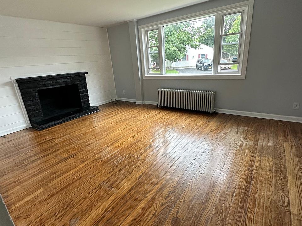 Living room with large picture window and non working ( decorative only ) fireplace