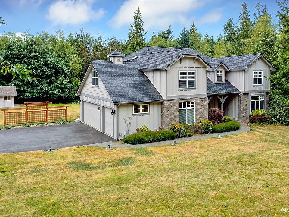 Drone shot of front of home, well-designed and not cookie cutter! You will love the lines, the accents, and the flat, useable yard. >