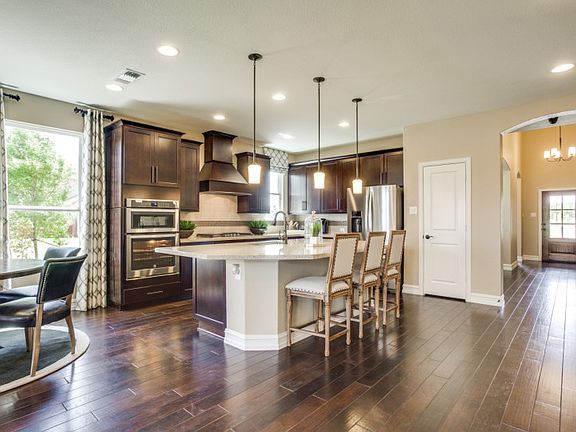 Model Representation - Open floorplan showcasing kitchen, spacious gathering room and additional dining areas