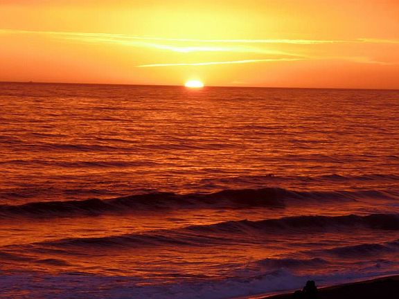 Sunset view from the driveway. The ADU has an ocean view from the gate when entering the unit.