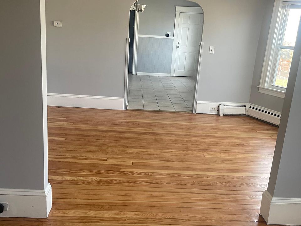 Freshly painted living room/dining room with refinished floors