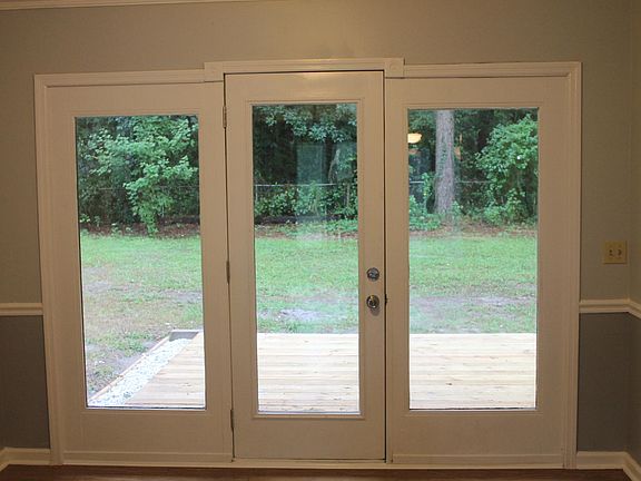 View from the dining room onto the patio and into the back yard