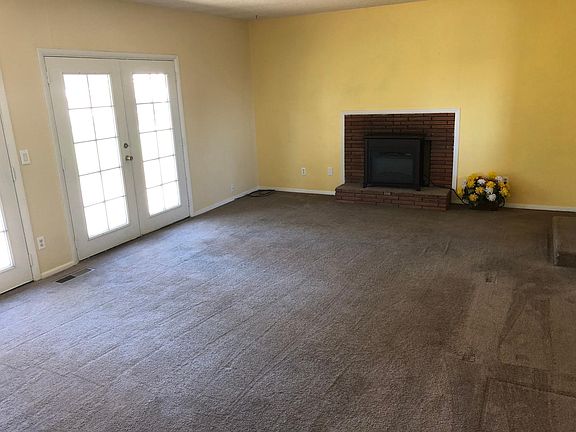 Sunken living room w/ electric fireplace
