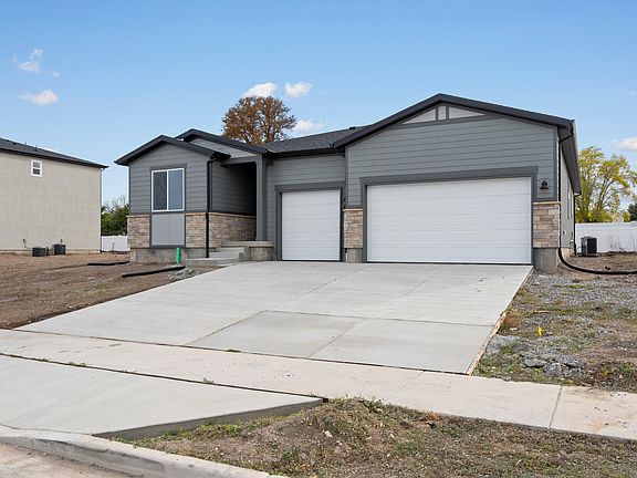 The Weber floorplan exterior image taken at a Meritage Homes Community in Grantsville, UT.