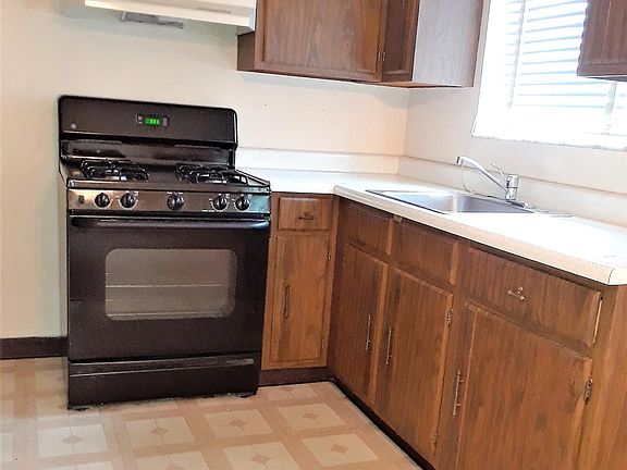 Kitchen with new cabinets and gas range