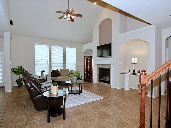 The Spacious Family Room offers beautiful architecture, tile floors and back yard views.