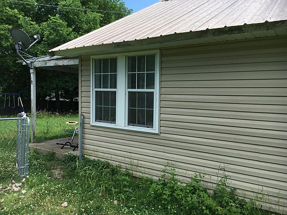 back porch and chain link gate from north side