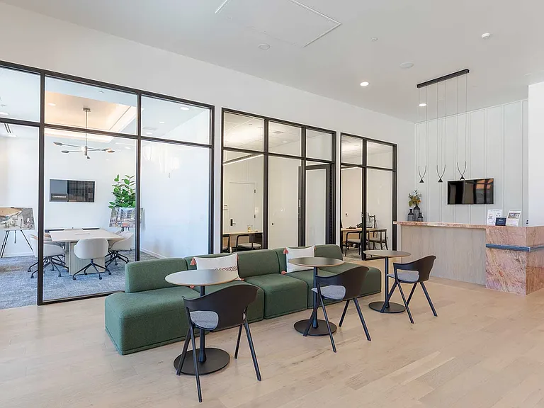 Flexible coworking lounges and private meeting rooms create a comfortable space to focus, collaborate, and work close to home.