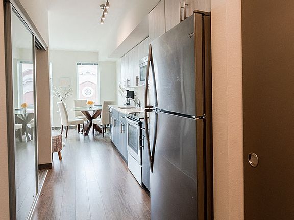 Seattle Apartments - Icon Apartments - Entryway, Kitchen, and Dining Room