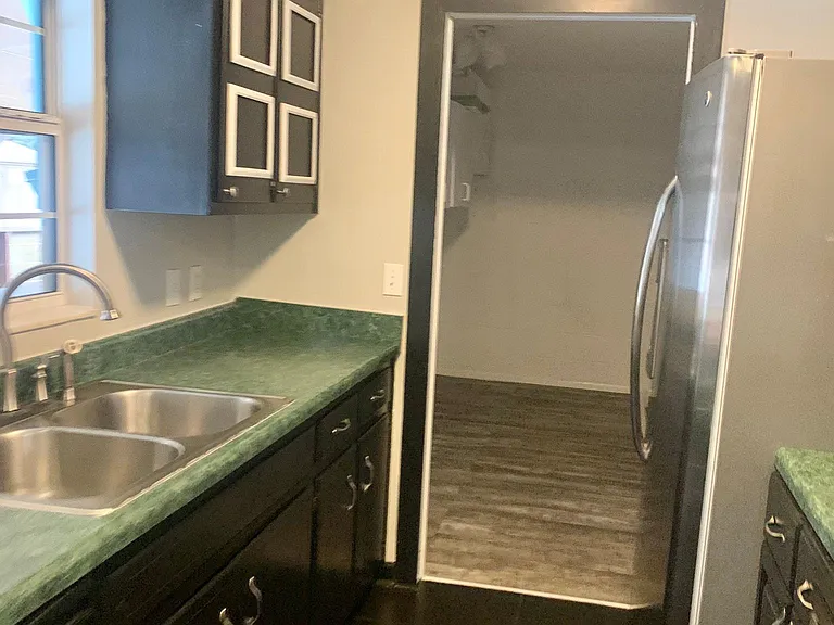 kitchen connects to laundry pantry area