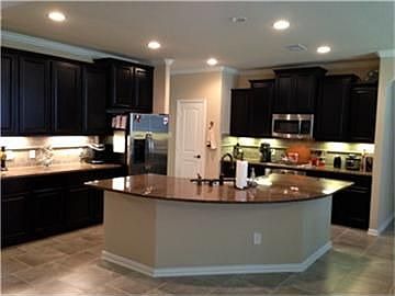 Chef's island kitchen with cherry cabinets, granite and tile floor