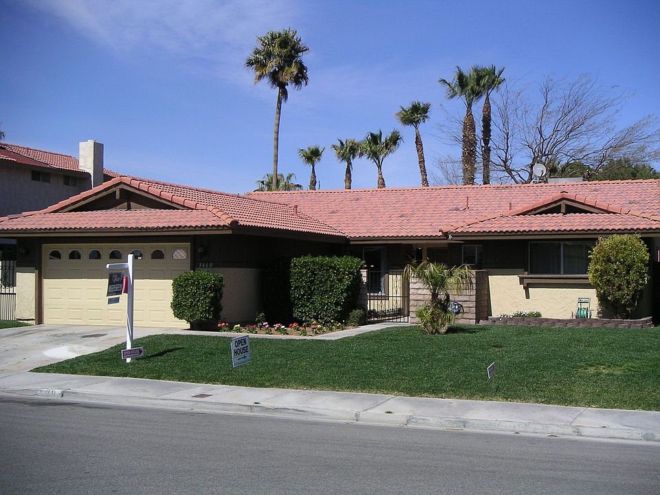 Full size drive way, lush front lawn with courtyard entry.