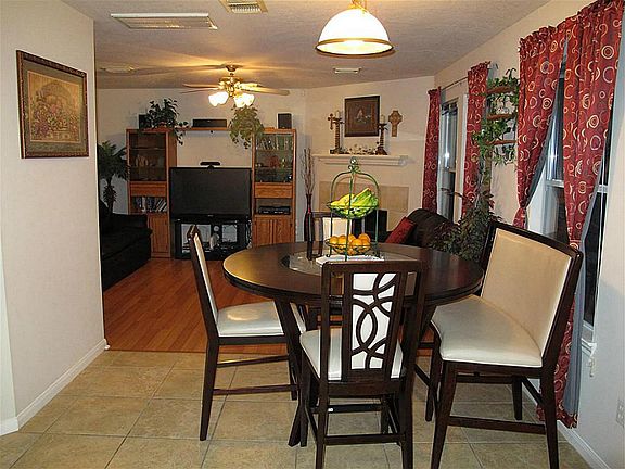 Charming breakfast area features ceramic tile flooring! What an excellent setting for informal meals or morning coffee!