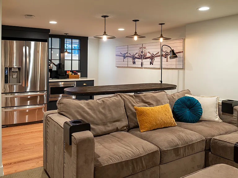 Full-size fridge in the basement with a microwave and coffee bar for guests.