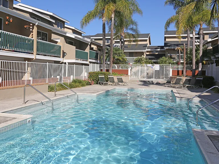 Pool-side view of the area with lounge chairs